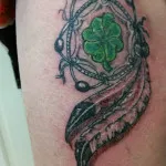 Feather pattern tattoo