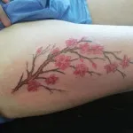 Pink flowers tattoo